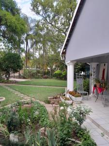 a porch of a house with a garden at Ebenezer Self Catering in Groblersdal