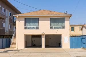 a large house with a garage in front of it at 28088 4B-Cozy & Quiet/Safe Bright 4brs Home in Daly City in Daly City
