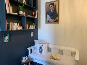 a room with a bed with a book shelf at Strand Stay in Strand +51 photos