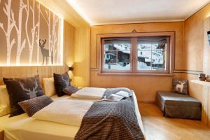 Postelja oz. postelje v sobi nastanitve Tramonto Villa Nordica