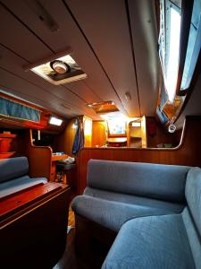 a train car with a couch and a window at Porto Antico Boat in Genova