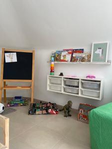 a childs room with a room with toys on the floor at La Buhardilla in Moya +38 photos