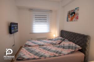 Postel nebo postele na pokoji v ubytování Petković apartmani 48