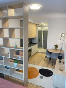a living room with a kitchen and a dining room at Apartment in Vilnius in Vilnius