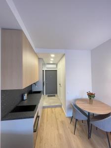 a kitchen with a table and a dining room at Apartment in Vilnius in Vilnius