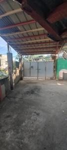 an empty parking lot in a building with a fence at LE Transient Homes - SC in Baguio