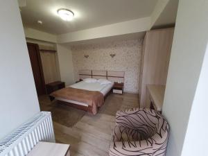 Postel nebo postele na pokoji v ubytování Hotel Stogu