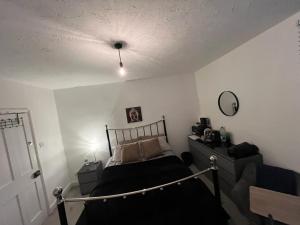 a bedroom with a bed and a ceiling at King Size Bed in a Double Bedroom in Ilkeston