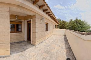 an exterior view of a house with a patio at El Carrascal in Caravaca de la Cruz