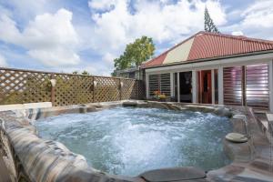 a hot tub in the backyard of a house at écrin de Monpierre in Brion +5 photos
