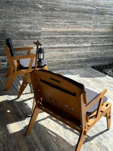 a wooden chair with a lamp on top of it at 大理安汋海景酒店 in Dali