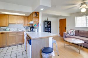 a kitchen and living room with a couch at Charming Albuquerque Apartment Near Old Town! in Albuquerque