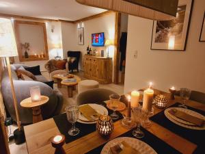 a living room with a table with candles on it at Alpine Vibes in Sankt Anton am Arlberg
