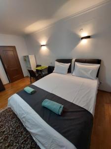 a bedroom with a large white bed with two pillows at Boutique Apartments Daniela in Ohrid