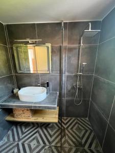 a bathroom with a sink and a shower at Villa Flower in Skiathos