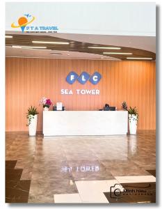 a sea tower lobby with a sign on the wall at FLC Luxury Apartment Quy Nhon in Quy Nhon +37 photos