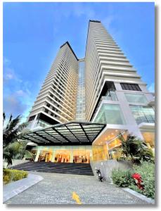 a large building with two tall skyscrapers at FLC Luxury Apartment Quy Nhon in Quy Nhon
