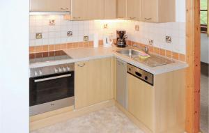 a small kitchen with a sink and a stove at Awesome Apartment In Flachau With 2 Bedrooms And Wifi in Flachau