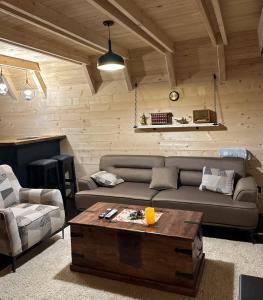 a living room with a couch and a coffee table at Portes du Soleil - Zabljak in Žabljak