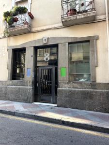 a building with a door on the side of a street at Rambla Alicante in Alicante