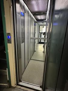 a hallway of a subway train with a glass door at Rambla Alicante in Alicante