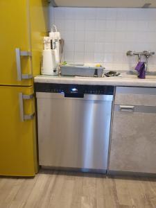 a kitchen with a dishwasher and a sink at Haus KanaleGrande in Haltern