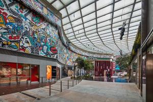 a large building with a ceiling covered in graffiti at Pillows CoLiving in Hong Kong