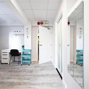 a dressing room with a desk and a mirror at Pillows CoLiving in Hong Kong