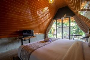 Postel nebo postele na pokoji v ubytování Mangoforest Bali