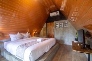 Postel nebo postele na pokoji v ubytování Mangoforest Bali