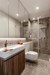 a bathroom with a sink and a toilet and a shower at PANORAMA VIEW by Mint Apartment in Krakow