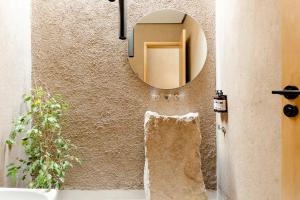 a bathroom with a mirror and a sink at Rancho Adobe Eco Hotel in Tupungato +160 photos