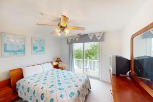 a bedroom with a bed and a ceiling fan at Seaside - Azure Dream B-302 in Virginia Beach