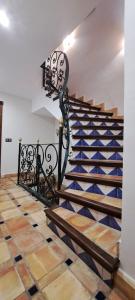 a set of stairs with a bench in the middle at CASITA ROCIO in Jaén