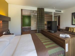 Ліжко або ліжка в номері Asia Hotel & Spa Leoben