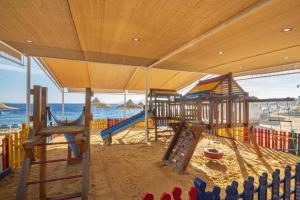a playground on the beach with a slide at Sultan Gardens Resort in Sharm El Sheikh