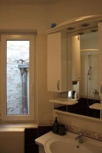 A bathroom at Cozy with parking