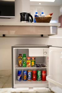 a refrigerator filled with lots of food and drinks at The Edition Bahawalpur in Bahawalpur