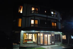 a building at night with its lights on at Guest House ANEX in Bansko