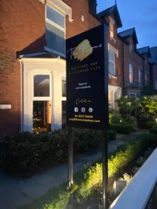 a sign in front of a house at The Rooms Lytham in Lytham St Annes