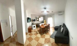 a living room with a couch and a table at Casa Cruz de Marbella Luque in Luque