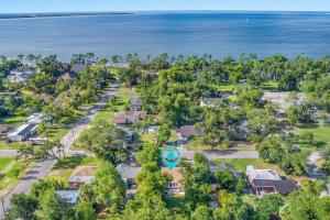 an aerial view of a neighborhood with houses and the ocean at Down By The Bay w Hot Tub, 2 Blocks 2 Beaches, Game Room, Reading Nook, Dog-Friendly, Historic Charm in Panama City