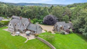 an aerial view of a large house with a yard at Pultheley Cottage in Montgomery