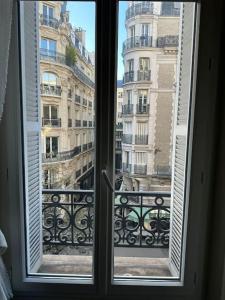 a window with a view of a building at Chic studio near chatelet les halles in Paris