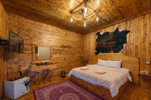 Voodi või voodid majutusasutuse Antique Inn toas +36 fotot