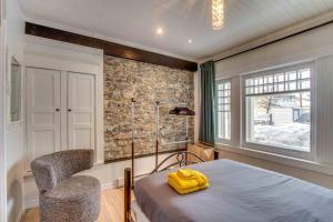 Postel nebo postele na pokoji v ubytování La Maison bleue des Artistes