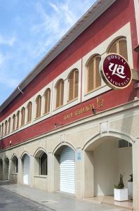 a building with a sign on the side of it at Hostal Ya in Aspe