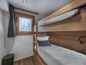 Postel nebo postele na pokoji v ubytování CHALET " JEANE " proche centre