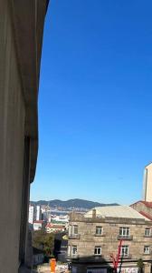 a view of a city from a window of a building at Traviesas in Vigo