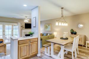 a kitchen and living room with a table and a dining room at Evian in Hilton Head Island